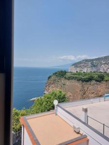 a view of the ocean from a building at Hotel Klein Wien in Piano di Sorrento