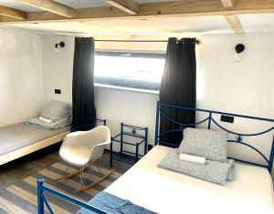 Postel nebo postele na pokoji v ubytování Hostel PrzyMorze