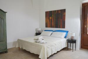 Postel nebo postele na pokoji v ubytování Palazzo Salvatori + 26 fotografií