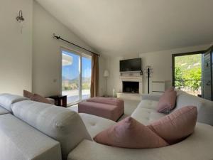 a living room with a couch and a fireplace at Bezirgan Inn Kalkan in Islamlar