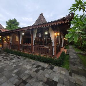 a pavilion at a resort at night at La Tavisa Hotel Borobudur in Magelang