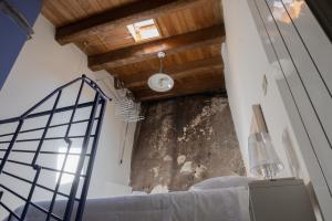 Postel nebo postele na pokoji v ubytování B&B Dimora Cigno