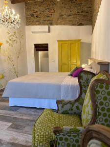 מיטה או מיטות בחדר ב-OlioeAlloro nel Borgo