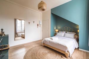 Ένα ή περισσότερα κρεβάτια σε δωμάτιο στο Le Sérénité - Studio Cocon à deux pas de la gare