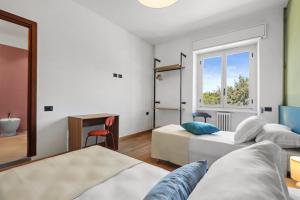 a bedroom with two beds and a window at Easy Stay Terni in Terni