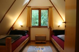 Postel nebo postele na pokoji v ubytování Haus 114 - Nurdachhaus - + 12 fotografií