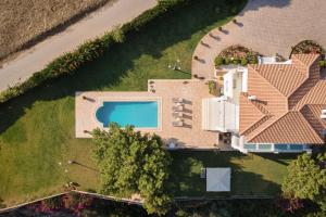 an aerial view of a house with a swimming pool at Villa Fantasia Isthmia in Isthmia
