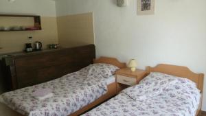 Säng eller sängar i ett rum på Apartment Bartulasi