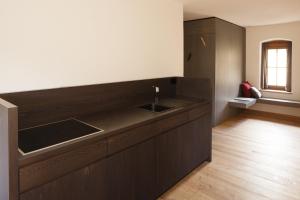 a kitchen with a sink and a counter at Josephus - Domicilium III in Madonna