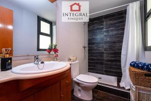 a bathroom with a sink and a toilet at Sapore di Mare Palamós in Palamós +18 photos