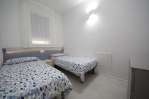 Postel nebo postele na pokoji v ubytování Ca' Del Mare