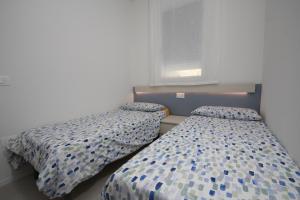 Postel nebo postele na pokoji v ubytování Ca' Del Mare