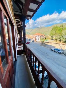 a balcony of a building with a view of a street at Hotel Oasis de la villa in Villa de Leyva