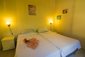 Ένα ή περισσότερα κρεβάτια σε δωμάτιο στο 28 Casa Kokolishi +8 φωτογραφίες