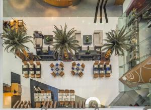 an overhead view of a shopping mall with palm trees at The Regenza By Tunga in Navi Mumbai