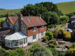 an aerial view of a house with a conservatory at Paythorne Farmhouse in Henfield