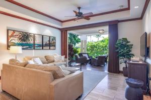 a living room with a couch and a ceiling fan at Kolea Kai 16D in Waikoloa