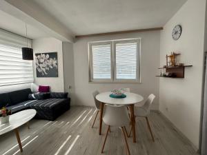 a living room with a couch and a table at Sea Star in Neum