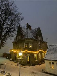 a large house with christmas lights on it at leilighet in Stavanger