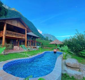 a swimming pool in front of a house at Moc Home Sapa in Sa Pa