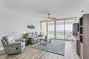 a living room with a couch and chairs and a table at Regency Condo 405 in Navarre