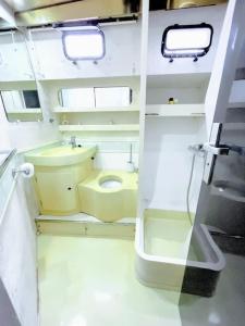 a small bathroom with a toilet and a sink at Séjour insolite à bord d'un Yacht à Porto Vecchio in Porto-Vecchio