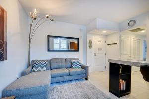 a living room with a couch and a fireplace at One Bedroom In Amazing Condobeach Pass Included! in Boynton Beach