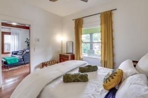 a large white bed in a room with a window at California Abode Near Universal Studios Hollywood! in Los Angeles