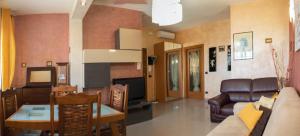 a living room with a couch and a table at Casa Ambra mare in Bordighera