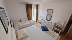 Ein Bett oder Betten in einem Zimmer der Unterkunft Apartment house Berry