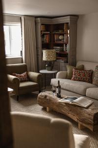 a living room with a couch and chairs and a table at Plum Bray in Bray