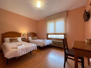 Postel nebo postele na pokoji v ubytování Hostal Torreblanca