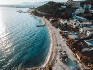 an aerial view of a beach next to the water at Beach Hotel Božikovina in Podstrana