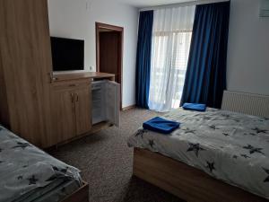 Postel nebo postele na pokoji v ubytování Casa Sturz