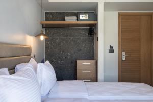 Ein Bett oder Betten in einem Zimmer der Unterkunft Prasonisi Light House Boutique Hotel
