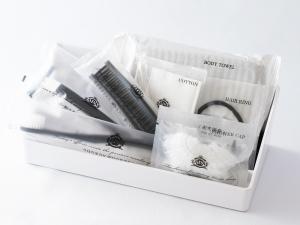 a white box filled with different types of toothbrushes at APA Hotel Shin Osaka Ekiminami in Osaka