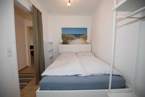 Postel nebo postele na pokoji v ubytování Terrassenhaus, FeWo 58