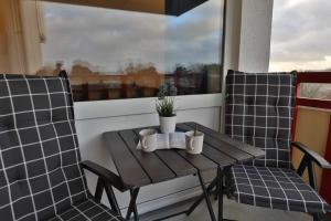 Posezení v ubytování Terrassenhaus, FeWo 58 + 10 fotografií