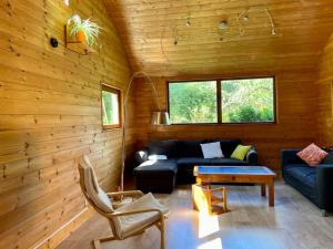 Zona de estar de Maison en bois chaleureuse près du Golf de l'Odet