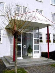 a building with a sign on the front of it at Hotel Hornung in Darmstadt