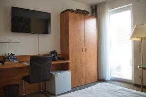 TV a/nebo společenská místnost v ubytování Hotel Quellenhof