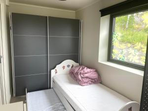 a small room with a bench and a window at VacationNorway in Froland Verk