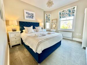 a bedroom with a large bed and a window at Montrose House in York