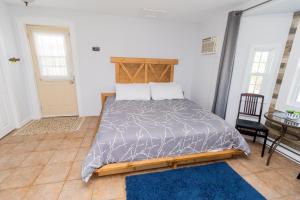 a bedroom with a bed and a table and chairs at Cache Rapids Vacation Rental in Reidville