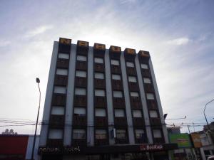 a tall building with windows on top of it at Hotel Nahuel in Rosario