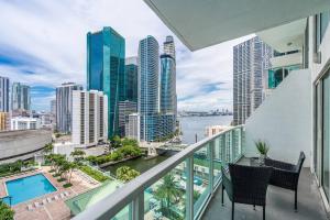 a balcony with chairs and a view of the city at Marvelous 2 bedroom Loft in Miami