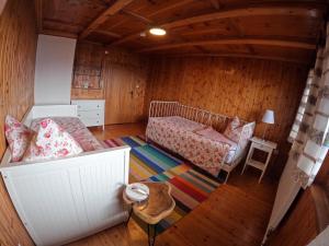 a small room with a bed and a table at Hinterfoisching - Chalet nahe Kitzbühel in Westendorf