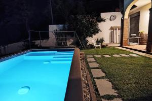 a swimming pool in the backyard of a house at Cilento Loft with Private Pool in Ascea