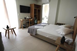 Postel nebo postele na pokoji v ubytování Mirabello Hotel