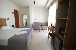 Postel nebo postele na pokoji v ubytování Mirabello Hotel